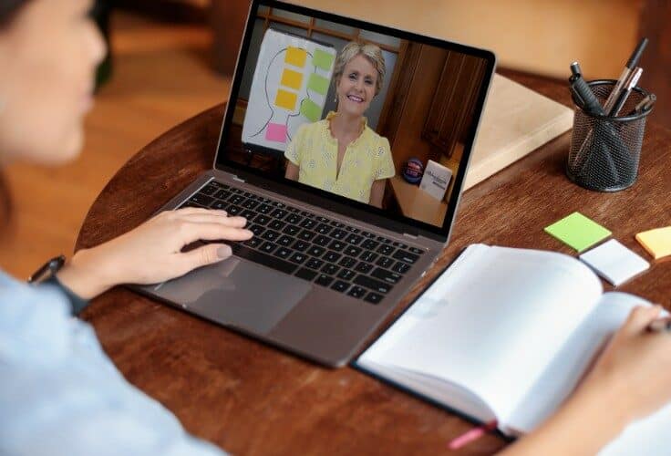 Educator watching CompCON on laptop CompCON reading comprehension conference